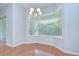 Bright dining room with bay window and hardwood floors is great for meals at 1208 Carriage Park Dr, Valrico, FL 33594