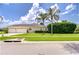 Well-maintained home with lush landscaping, mature trees, and a convenient three-car garage at 1208 Carriage Park Dr, Valrico, FL 33594