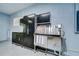 This garage boasts convenient organization with a stainless steel dog washing station and storage cabinetry at 1208 Carriage Park Dr, Valrico, FL 33594