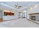 Open living room showcasing a fireplace, kitchen view, and a bright, welcoming atmosphere at 1208 Carriage Park Dr, Valrico, FL 33594