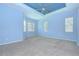 Spacious main bedroom with ceiling fan and carpeted flooring at 1208 Carriage Park Dr, Valrico, FL 33594