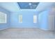 Relaxing main bedroom features a tray ceiling and ample natural light at 1208 Carriage Park Dr, Valrico, FL 33594