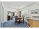 Cozy dining area next to the kitchen with a chandelier and seating for four at 1270 Inverness, Dunedin, FL 34698