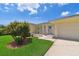 Charming single-story home featuring a well-manicured lawn and inviting curb appeal at 1270 Inverness, Dunedin, FL 34698