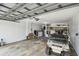 Spacious garage with a golf cart and access to a utility area at 1270 Inverness, Dunedin, FL 34698