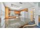 Kitchen featuring light wood cabinetry, granite countertops, and a skylight at 1270 Inverness, Dunedin, FL 34698