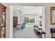 Living room view to backyard, featuring neutral walls, a ceiling fan and comfortable seating at 1270 Inverness, Dunedin, FL 34698