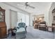Comfortable living room featuring neutral walls and carpet, fan, and seating, and open floorplan at 1270 Inverness, Dunedin, FL 34698