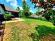 Expansive backyard with verdant lawn, stone pathway, and partial backyard fence at 12862 Rangeland Blvd, Odessa, FL 33556