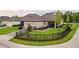 Beautiful fenced backyard, with lush lawn and outdoor seating area at 12862 Rangeland Blvd, Odessa, FL 33556