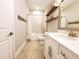 Bright bathroom featuring tile flooring, modern fixtures, and decorative shelving for a clean, updated look at 12862 Rangeland Blvd, Odessa, FL 33556