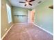 A spacious bedroom with natural light and a ceiling fan for added comfort at 12862 Rangeland Blvd, Odessa, FL 33556