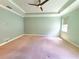 Light and airy bedroom with neutral carpet, tray ceiling, and recessed lighting at 12862 Rangeland Blvd, Odessa, FL 33556