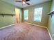 A spacious bedroom featuring neutral paint, carpet, and lots of natural light at 12862 Rangeland Blvd, Odessa, FL 33556