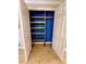 Deep walk-in closet with custom shelving system, offering optimal storage space at 12862 Rangeland Blvd, Odessa, FL 33556
