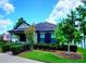 Attractive single-story house with well-maintained lawn, charming landscaping, and American flag at 12862 Rangeland Blvd, Odessa, FL 33556