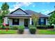 Inviting single-story home featuring a well-manicured lawn and tidy landscaping at 12862 Rangeland Blvd, Odessa, FL 33556