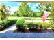 Covered front porch featuring a brick-paved surface and manicured shrubbery at 12862 Rangeland Blvd, Odessa, FL 33556