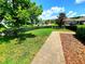 Well-manicured front yard features lush lawn, stone pavers, and attractive landscaping at 12862 Rangeland Blvd, Odessa, FL 33556