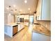 Light and bright kitchen with granite countertops, stainless appliances, and a central island at 12862 Rangeland Blvd, Odessa, FL 33556