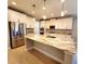 Gorgeous kitchen with stainless steel appliances, large island and breakfast bar, plus granite countertops at 12862 Rangeland Blvd, Odessa, FL 33556