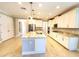 Spacious eat-in kitchen with stainless appliances, large island with sink, and marble countertops at 12862 Rangeland Blvd, Odessa, FL 33556