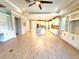 Open floor plan offering living room with kitchen and dining area, and ample natural light at 12862 Rangeland Blvd, Odessa, FL 33556