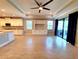 Spacious living room with built-in cabinets, fireplace, and sliding glass doors leading to an outdoor patio at 12862 Rangeland Blvd, Odessa, FL 33556