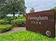 Cunningham Park sign surrounded by beautiful greenery and landscaping at 12862 Rangeland Blvd, Odessa, FL 33556