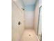 Walk-in shower featuring white subway tile, rainfall shower head and glass enclosure at 12862 Rangeland Blvd, Odessa, FL 33556