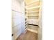 Functional walk-in closet features shelving, drawers, and hanging rods for efficient storage solutions at 12862 Rangeland Blvd, Odessa, FL 33556
