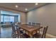 Open dining room with wood-look floors and a large wooden table with seating for six at 13029 111Th Ln, Largo, FL 33778