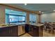 Well-equipped kitchen featuring stainless steel appliances, granite countertops, and dark wood cabinetry at 13029 111Th Ln, Largo, FL 33778
