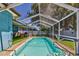 Inviting screened-in pool with a spacious deck, ideal for enjoying the outdoors and entertaining at 13029 111Th Ln, Largo, FL 33778
