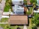 Overhead view of the property clearly showing the layout of the house, yard, and outdoor deck areas at 13148 3Rd E St, Madeira Beach, FL 33708
