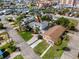 Drone shot of the property showing an overview of the backyard, deck area, and surrounding neighborhood at 13148 3Rd E St, Madeira Beach, FL 33708