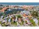 Aerial view of the home near a marina and beach, offering a glimpse of the beautiful coastal surroundings at 13148 3Rd E St, Madeira Beach, FL 33708
