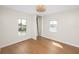 Bright bedroom with wood floors and dual windows, with closet at 13148 3Rd E St, Madeira Beach, FL 33708