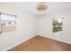 Bedroom with bright natural light and wood-look laminate flooring at 13148 3Rd E St, Madeira Beach, FL 33708