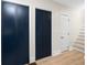 Hallway featuring doors and wood floors at 13148 3Rd E St, Madeira Beach, FL 33708