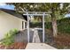 Backyard oasis featuring a unique seating arrangement and lush landscaping at 13501 Avista Dr, Tampa, FL 33624