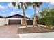 Exterior view of home with palm trees, brick driveway and attractive landscaping at 13501 Avista Dr, Tampa, FL 33624