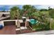 Charming home featuring a two-car garage, private pool, and beautiful mature trees at 13501 Avista Dr, Tampa, FL 33624