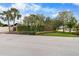 Exterior front view of home with lush landscaping and mature trees, adding curb appeal at 13501 Avista Dr, Tampa, FL 33624