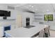 Bright modern kitchen with an island, stainless steel appliances, and lots of storage at 13501 Avista Dr, Tampa, FL 33624