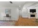 Inviting living room features hardwood floors, a fireplace, and ample natural light at 13501 Avista Dr, Tampa, FL 33624
