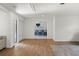 Spacious living room featuring wood-look tile floors and an open view to the kitchen at 13501 Avista Dr, Tampa, FL 33624