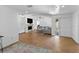 Spacious living room with hardwood floors, a fireplace, and comfortable seating at 13501 Avista Dr, Tampa, FL 33624