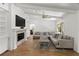 Cozy living room with a fireplace, neutral tones, and comfortable seating arrangement at 13501 Avista Dr, Tampa, FL 33624