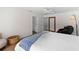 Bright main bedroom with a ceiling fan and large closet space at 13501 Avista Dr, Tampa, FL 33624